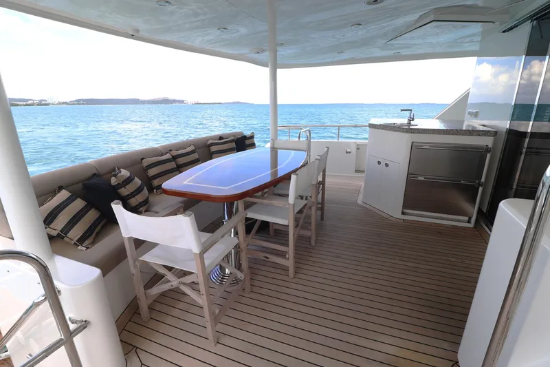 Slide: The Image of Outdoor dining area on 2013 Cheoy Lee Bravo yacht with ocean view. - 11