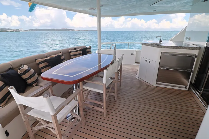 Slide: The Image of Outdoor deck of 2013 Cheoy Lee Bravo yacht with dining area and ocean view. - 12