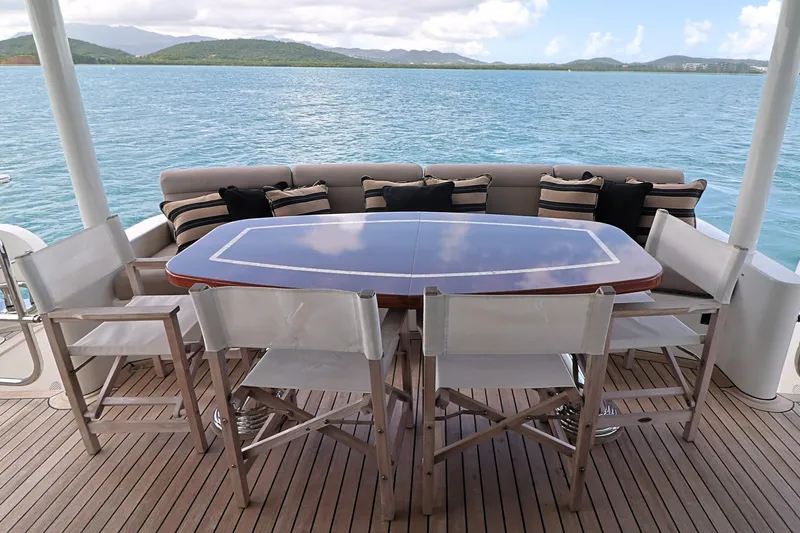 Slide: The Image of Outdoor dining area on 2013 Cheoy Lee Bravo yacht with scenic ocean view. - 13