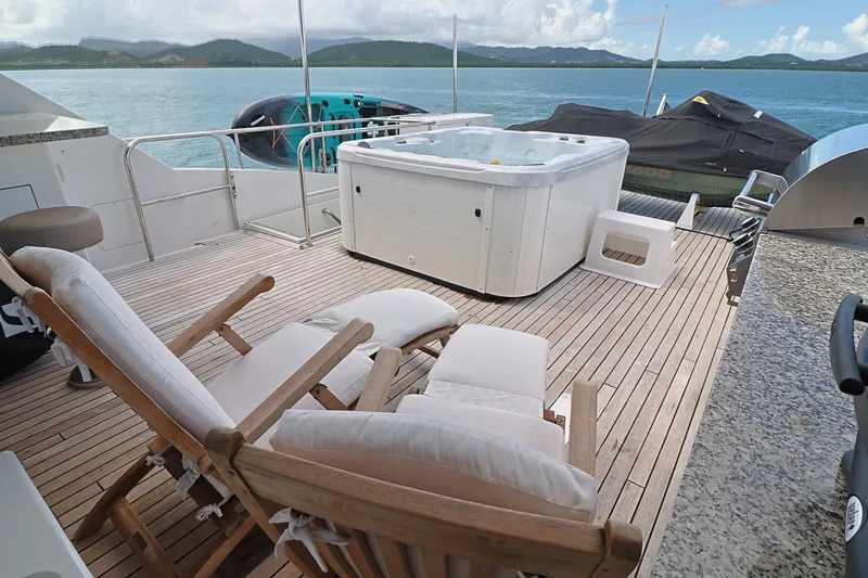 Slide: The Image of Deck of 2013 Cheoy Lee Bravo yacht with hot tub and lounge chairs. - 18