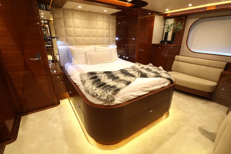 Slide: The Image of Luxurious 2013 Cheoy Lee Bravo yacht bedroom with elegant wood finishes and plush bedding. - 37