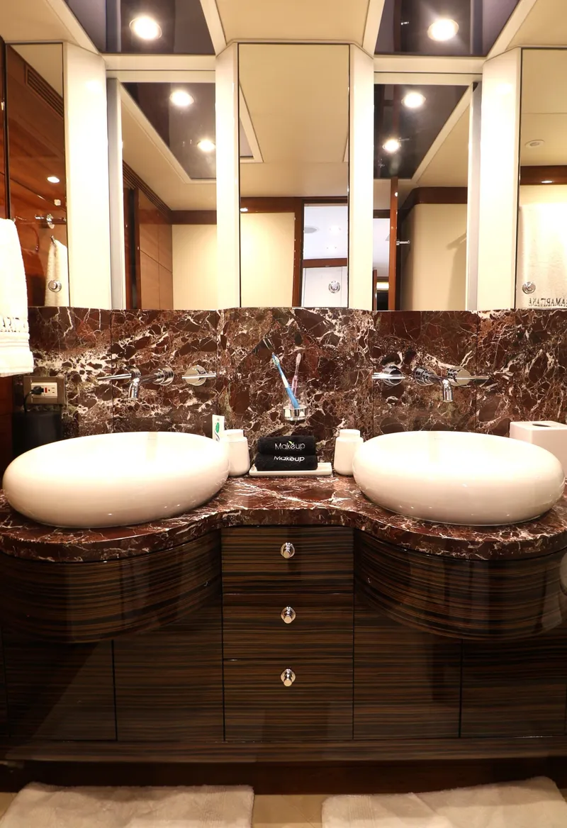 Slide: The Image of Luxurious bathroom with dual sinks and marble countertop on a 2013 Cheoy Lee Bravo yacht. - 44