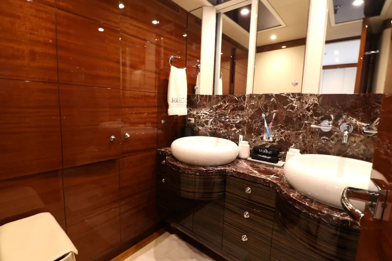 Slide: The Image of Luxurious bathroom in 2013 Cheoy Lee Bravo yacht with dual sinks and elegant wood paneling. - 45