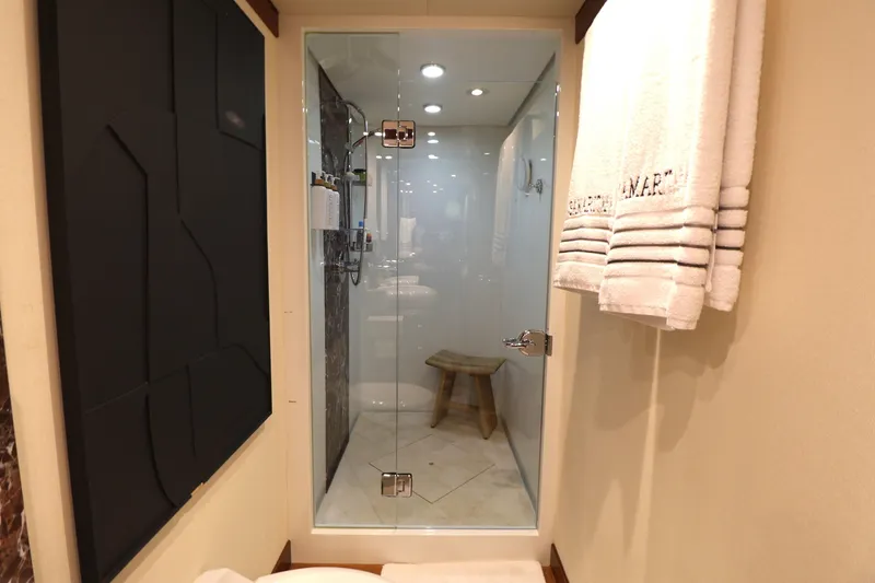 Slide: The Image of Luxurious bathroom shower in 2013 Cheoy Lee Bravo yacht, featuring glass door and elegant design. - 46