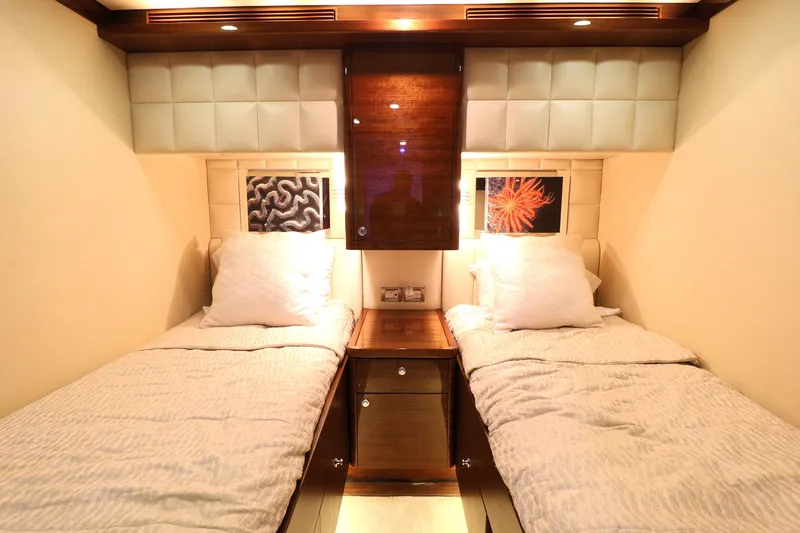 Slide: The Image of Luxurious twin cabin interior on 2013 Cheoy Lee Bravo yacht, featuring elegant bedding and ambient lighting. - 49