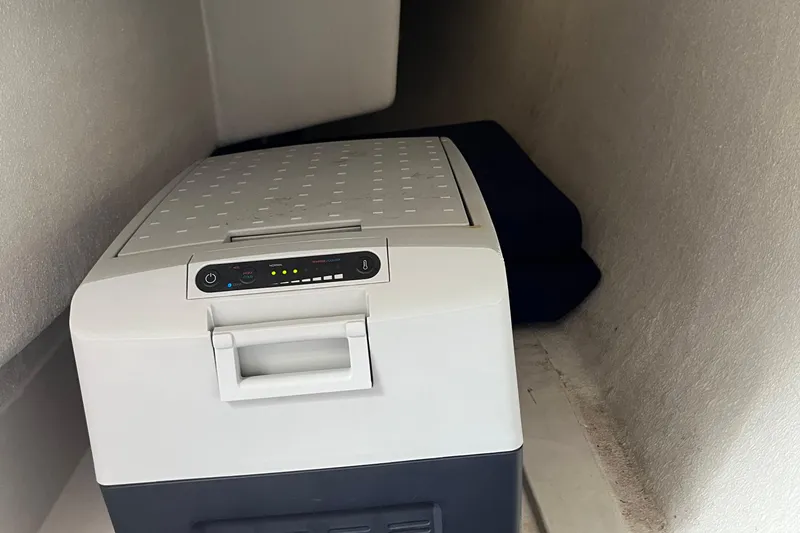 Slide: The Image of Compact cooler inside 2023 Saffier 8m Open boat storage compartment. - 11