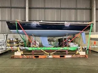 Slide: The Image of 2023 Saffier 8m Open sailboat in warehouse, secured with straps. - 5