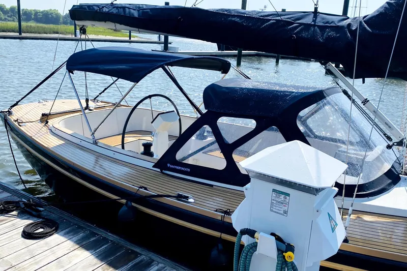 Slide: The Image of 2023 Saffier 8m Open yacht docked, featuring sleek design and modern canopy. - 8