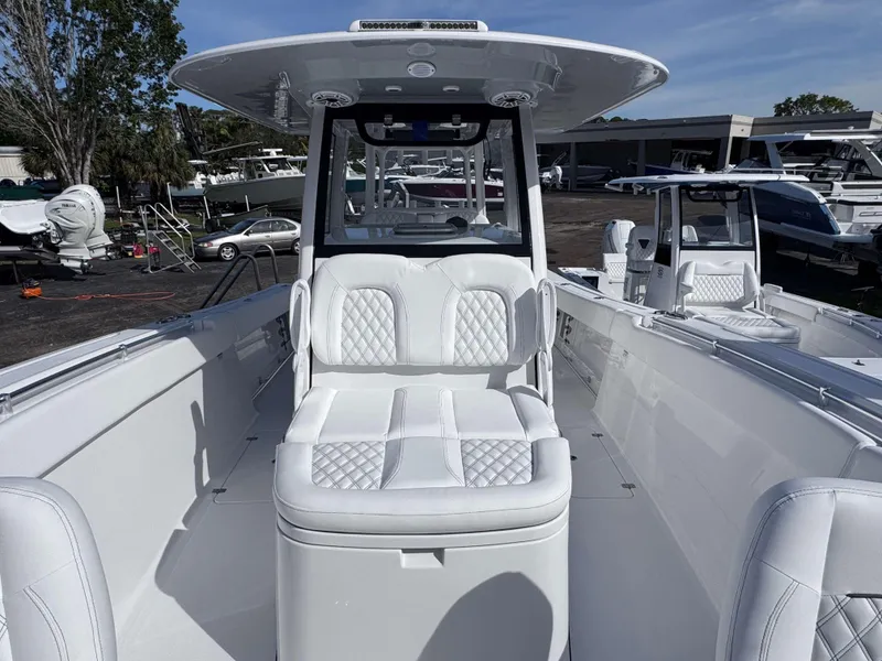 Slide: The Image of 2025 Sportsman 322 Open boat with white seating and sleek design. - 11