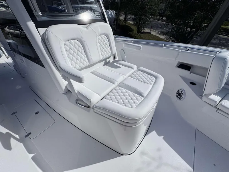 Slide: The Image of Luxurious seating on 2025 Sportsman 322 Open boat, featuring elegant white upholstery. - 12
