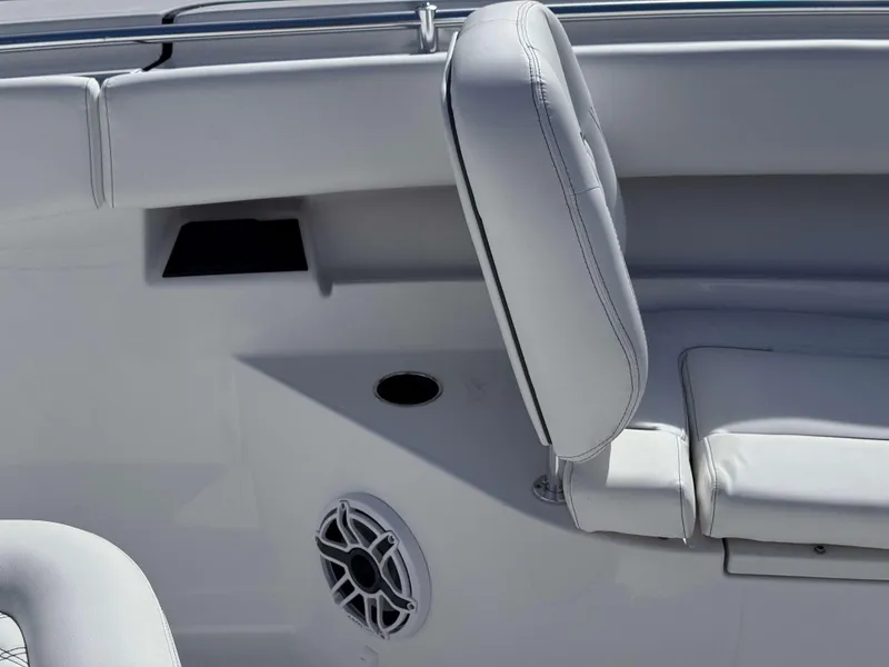 Slide: The Image of 2025 Sportsman 322 Open boat interior with white seating and speaker detail. - 13