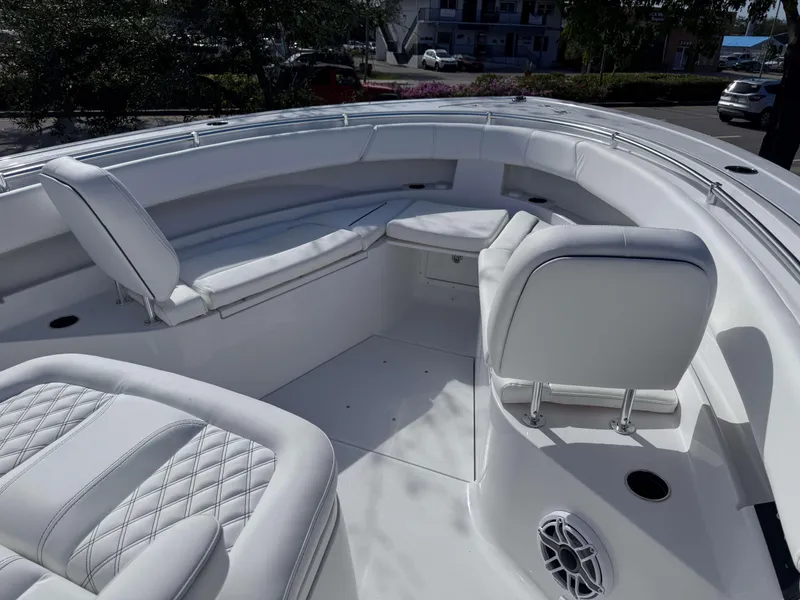 Slide: The Image of 2025 Sportsman 322 Open boat interior with white seating and modern design. - 14