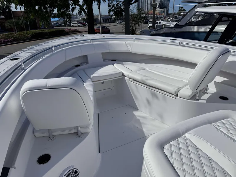 Slide: The Image of 2025 Sportsman 322 Open boat interior with white seating and modern design. - 15