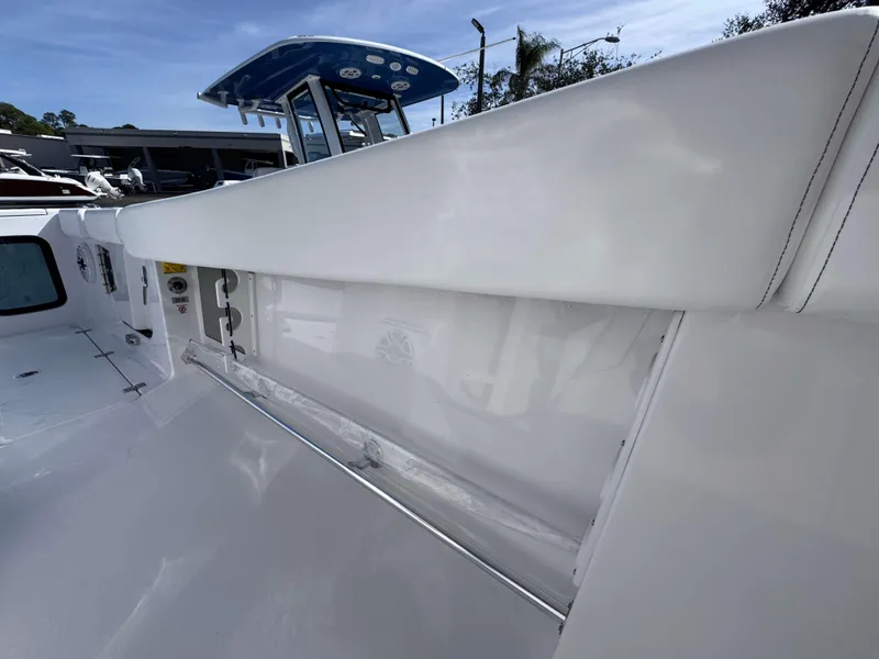 Slide: The Image of 2025 Sportsman 322 Open boat interior, featuring sleek white design and modern amenities. - 17