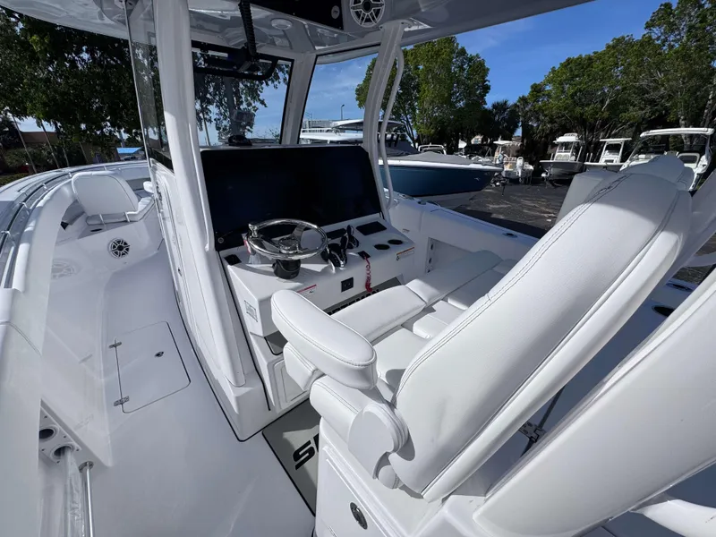 Slide: The Image of 2025 Sportsman 322 Open boat interior with modern helm and seating. - 18