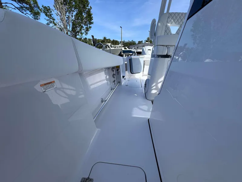 Slide: The Image of 2025 Sportsman 322 Open boat interior, featuring sleek white design and modern seating. - 23