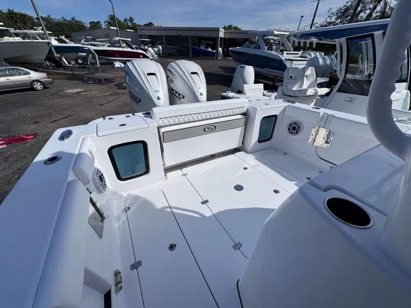Slide: The Image of 2025 Sportsman 322 Open boat interior with dual engines, spacious deck, and seating area. - 24