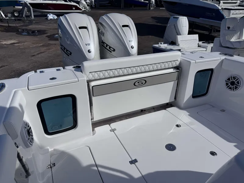 Slide: The Image of 2025 Sportsman 322 Open boat with dual Yamaha engines, sleek white deck design. - 25