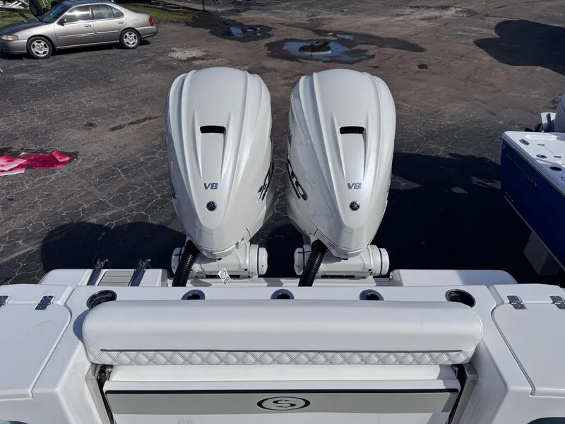 Slide: The Image of 2025 Sportsman 322 Open with dual V8 engines, parked on asphalt. - 26