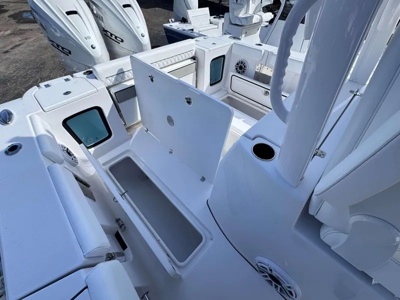Slide: The Image of 2025 Sportsman 322 Open boat interior with storage compartments and seating. - 28