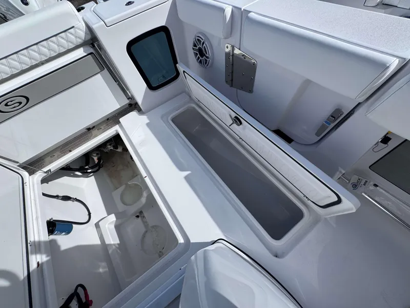 Slide: The Image of 2025 Sportsman 322 Open boat interior with storage compartments and speaker. - 29