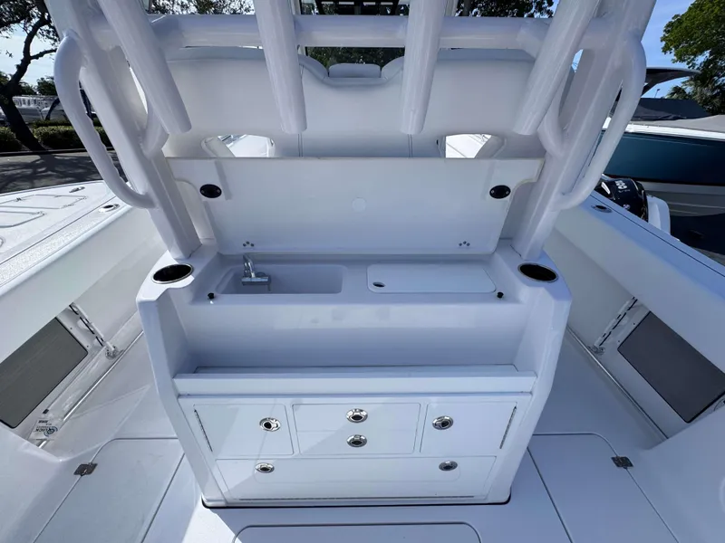 Slide: The Image of 2025 Sportsman 322 Open boat interior with storage and sink. - 31