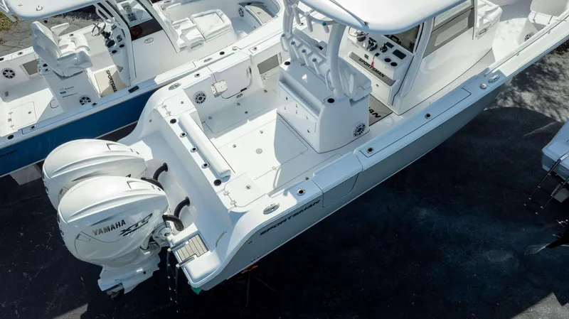 Slide: The Image of 2025 Sportsman 322 Open boat with dual Yamaha engines, aerial view. - 4