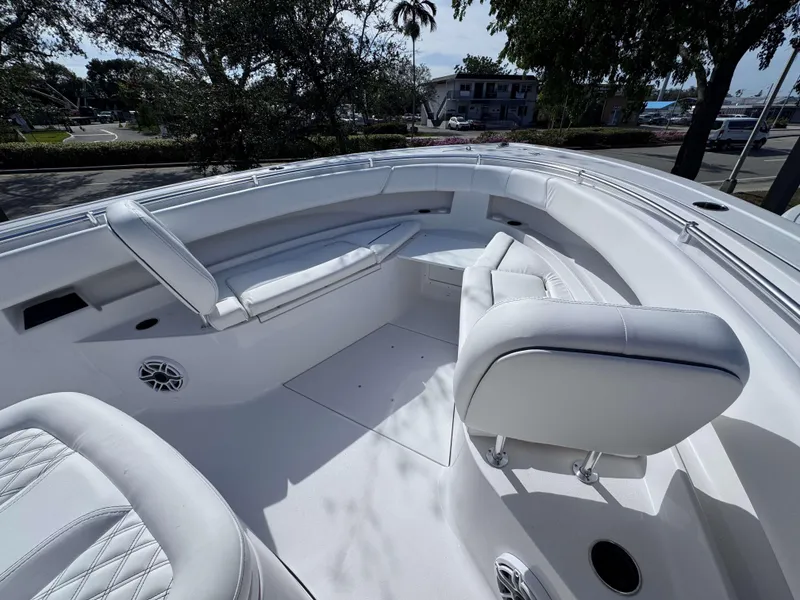 Slide: The Image of 2025 Sportsman 322 Open boat interior with white seating and modern design. - 8