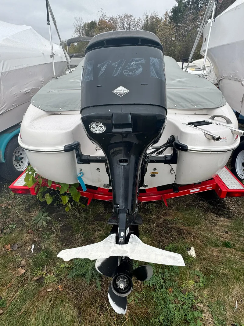 Slide: The Image of 2005 Tahoe Q4SF boat with outboard motor on a trailer. - 3
