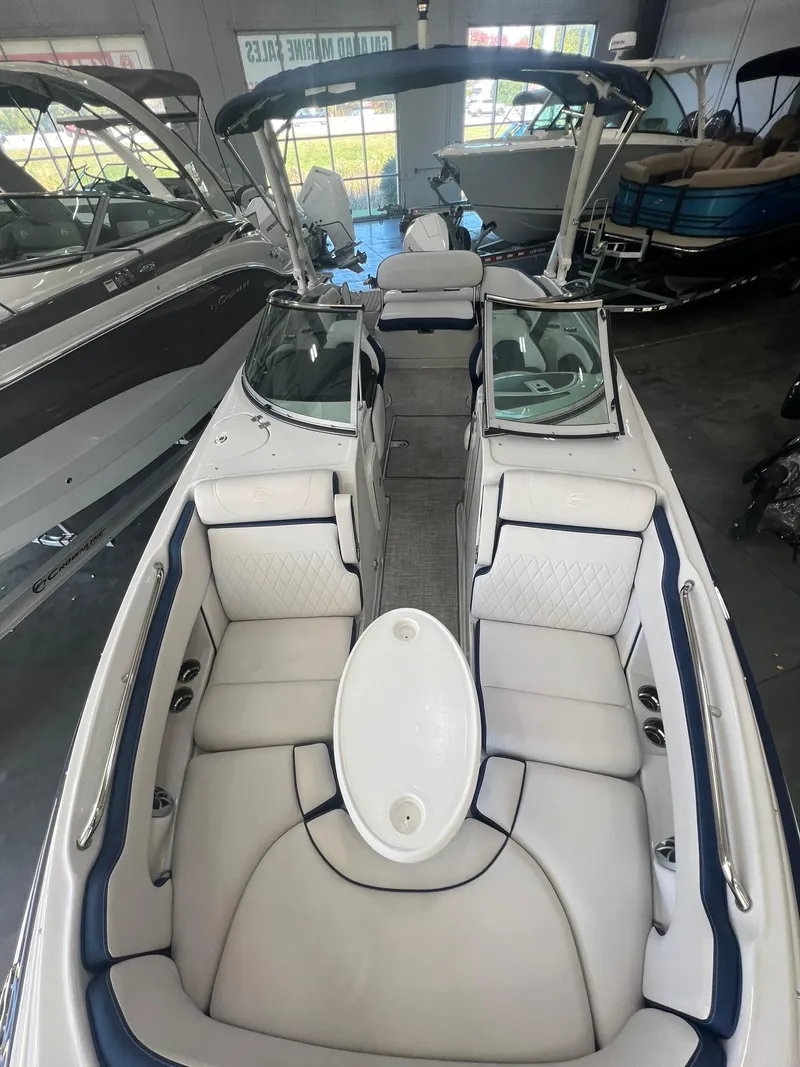 Slide: The Image of 2025 Crownline Eclipse E260 XS boat interior with spacious seating and modern design. - 19