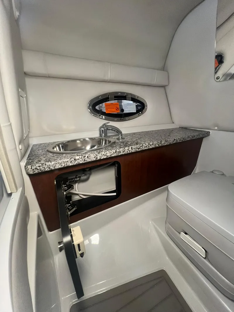 Slide: The Image of 2025 Crownline Eclipse E260 XS interior with sink and countertop. - 21
