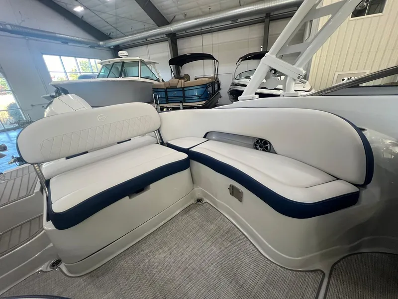 Slide: The Image of 2025 Crownline Eclipse E260 XS boat interior with white and blue seating. - 37