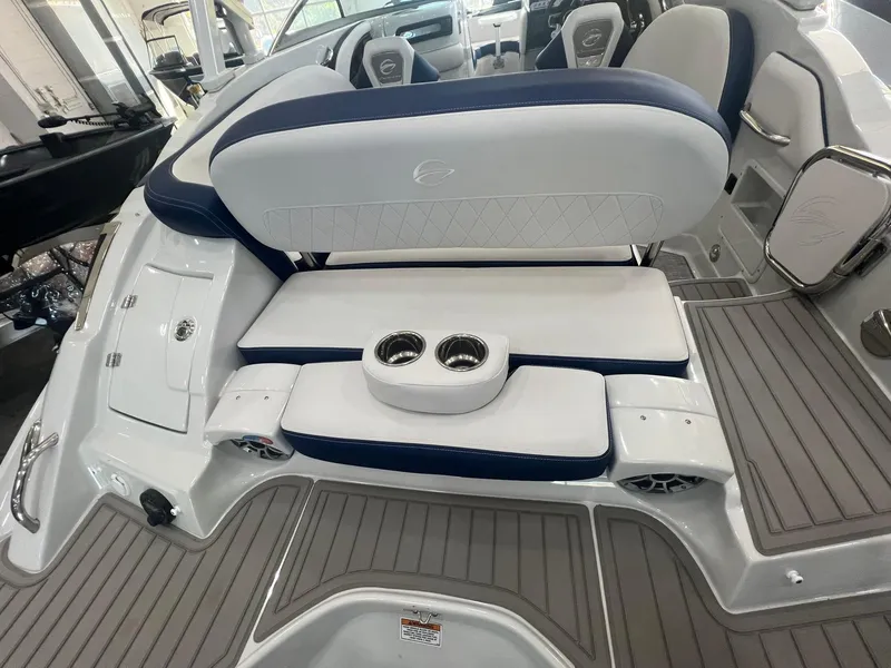 Slide: The Image of 2025 Crownline Eclipse E260 XS boat interior with cushioned seating and cup holders. - 39