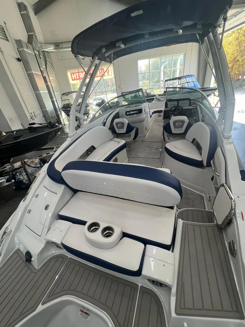 Slide: The Image of 2025 Crownline Eclipse E260 XS boat interior with spacious seating and modern design. - 5