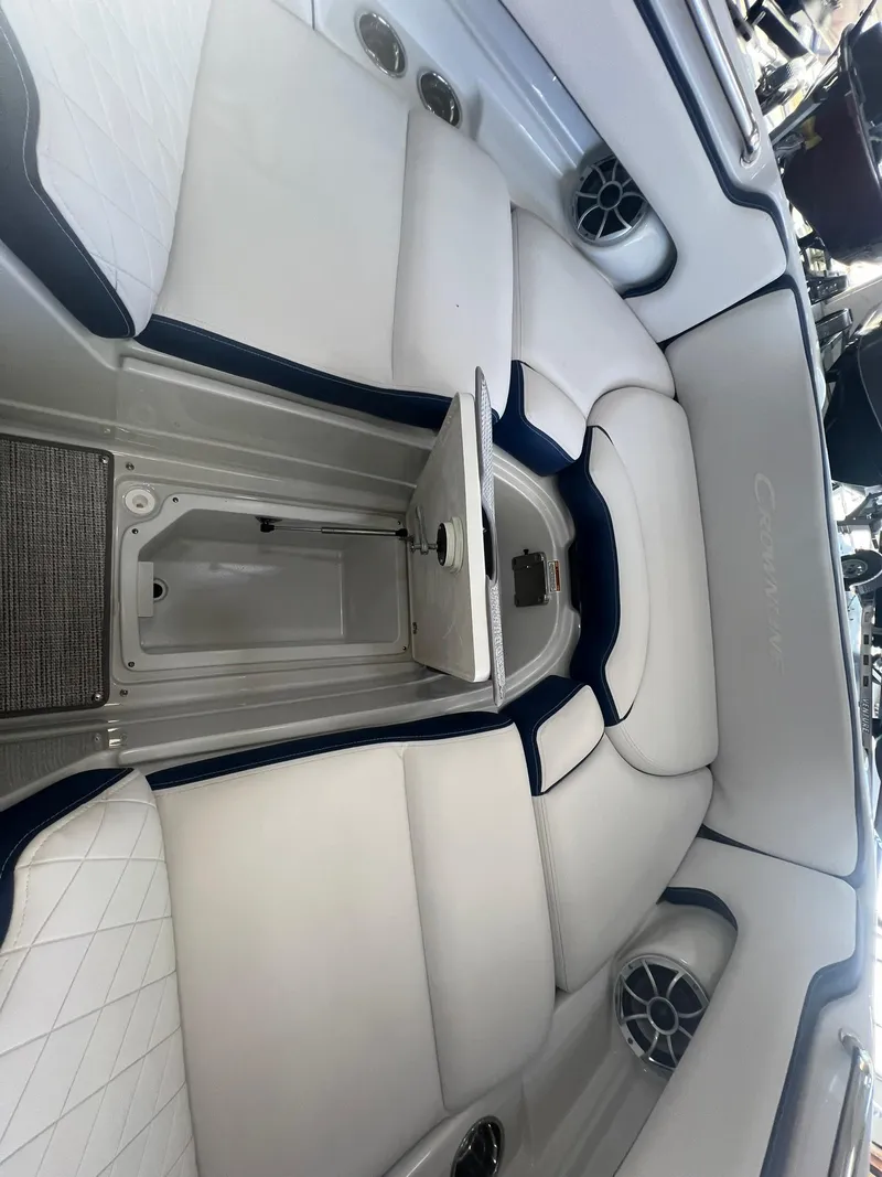 Slide: The Image of 2025 Crownline Eclipse E260 XS boat interior with white seating and sleek design. - 9