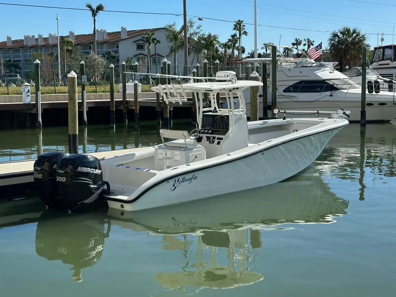 Slide: The Image of 2001 Yellowfin 31 boat docked with twin Mercury engines. - 1