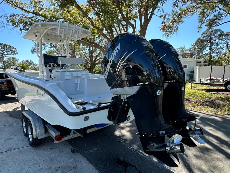 Slide: The Image of 2001 Yellowfin 31 boat with dual Mercury outboard engines on a trailer. - 10