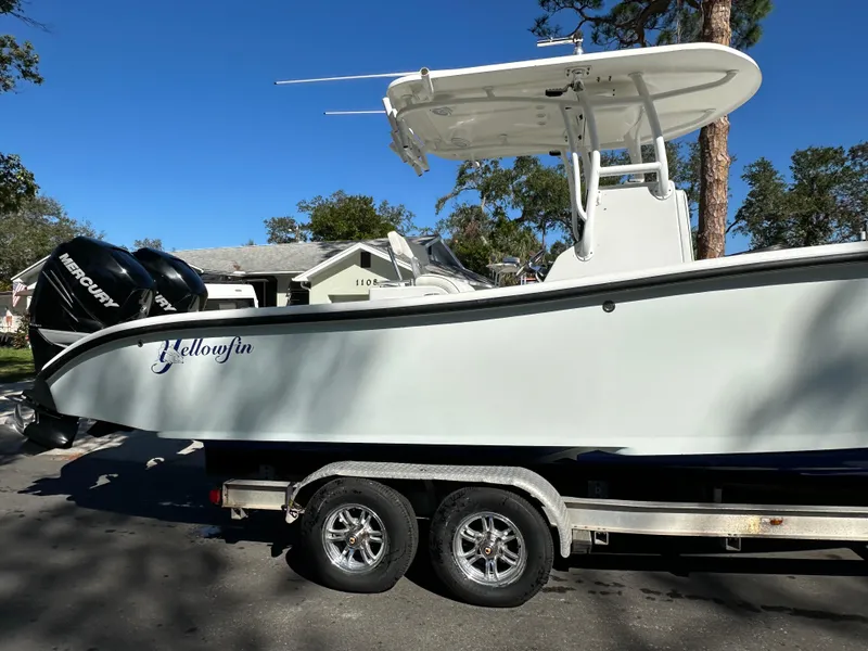 Slide: The Image of 2001 Yellowfin 31 boat on trailer with dual Mercury engines. - 15