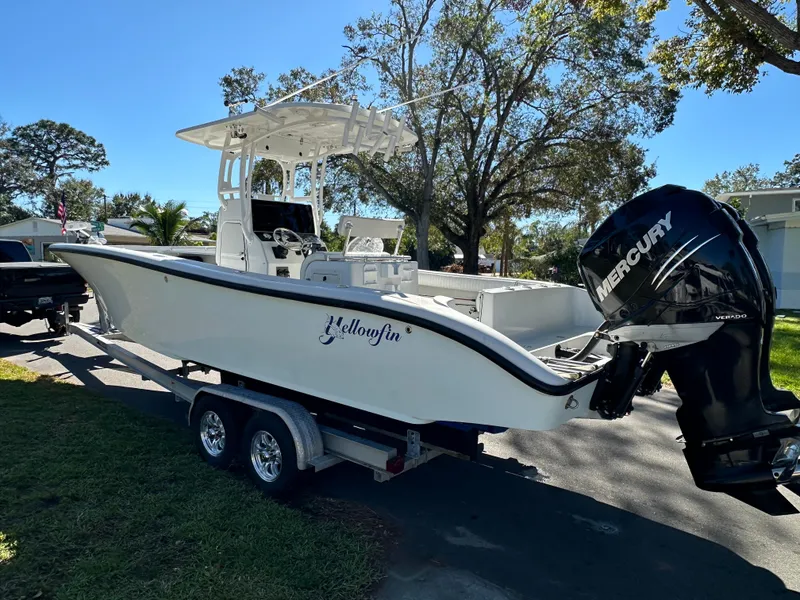 Slide: The Image of 2001 Yellowfin 31 boat on trailer with Mercury outboard motor. - 16