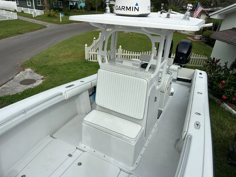 Slide: The Image of 2001 Yellowfin 31 boat with Garmin equipment, white seating, and spacious deck. - 21