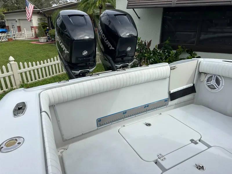Slide: The Image of 2001 Yellowfin 31 boat with dual Mercury outboard engines, white interior, and measuring scale. - 23