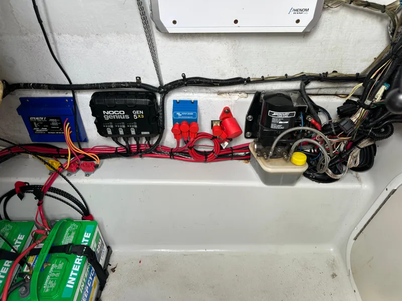 Slide: The Image of Electrical components and wiring inside a 2001 Yellowfin 31 boat. - 24