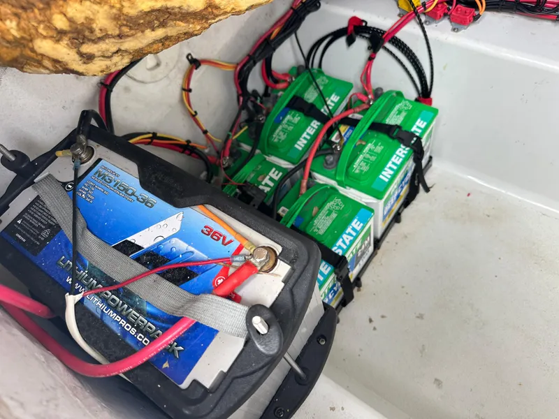 Slide: The Image of Boat battery setup in a 2001 Yellowfin 31, featuring multiple Interstate batteries. - 25