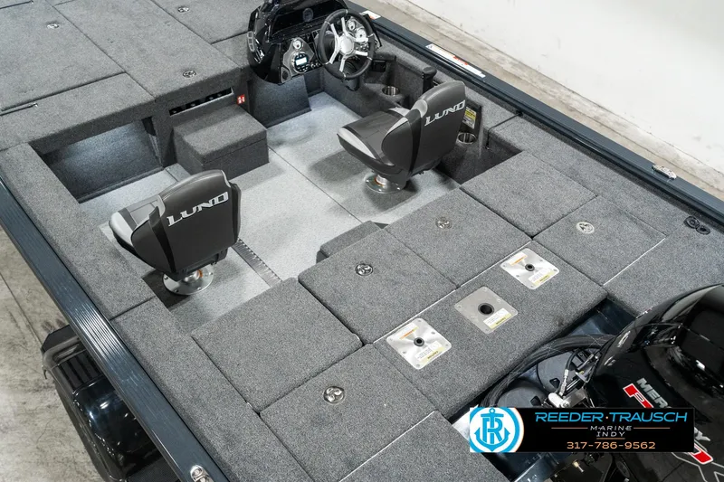 Slide: The Image of 2025 Lund 1875 Pro-V Bass XS boat interior with seating and storage compartments. - 10