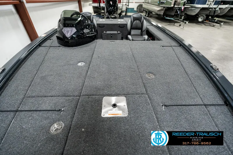 Slide: The Image of 2025 Lund 1875 Pro-V Bass XS boat interior with spacious deck and seating. - 11