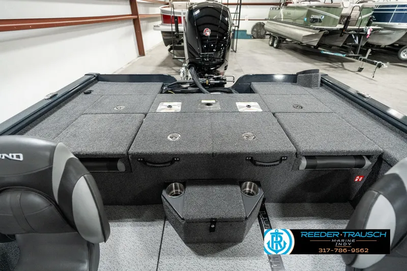 Slide: The Image of 2025 Lund 1875 Pro-V Bass XS boat interior with seating and storage compartments. - 14