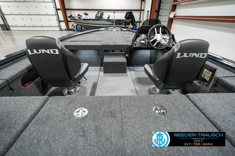 Slide: The Image of 2025 Lund 1875 Pro-V Bass XS interior with dual seats and steering console. - 15