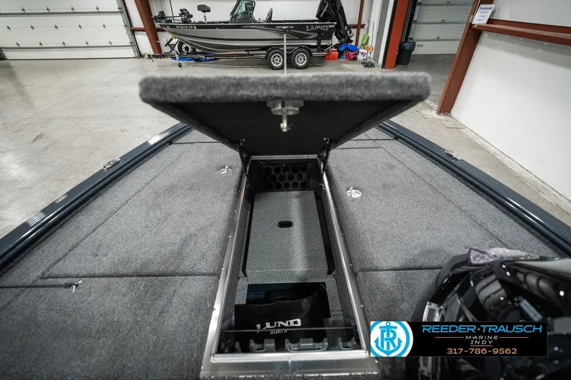 Slide: The Image of 2025 Lund 1875 Pro-V Bass XS boat interior with open storage compartment. - 20