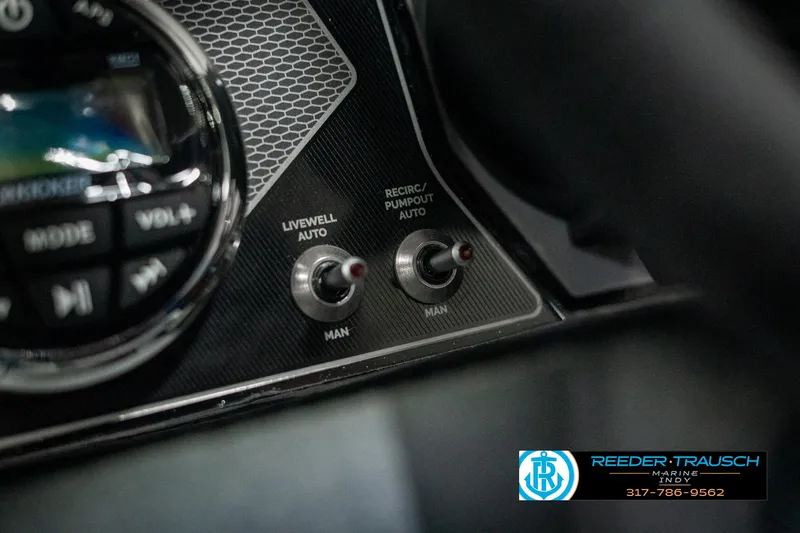 Slide: The Image of Close-up of 2025 Lund 1875 Pro-V Bass XS dashboard controls. - 28