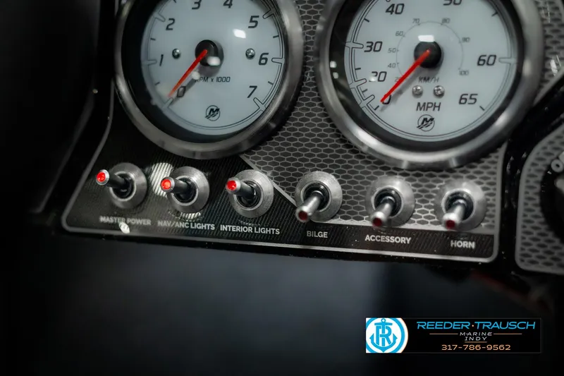 Slide: The Image of Dashboard of 2025 Lund 1875 Pro-V Bass XS with gauges and control switches. - 32